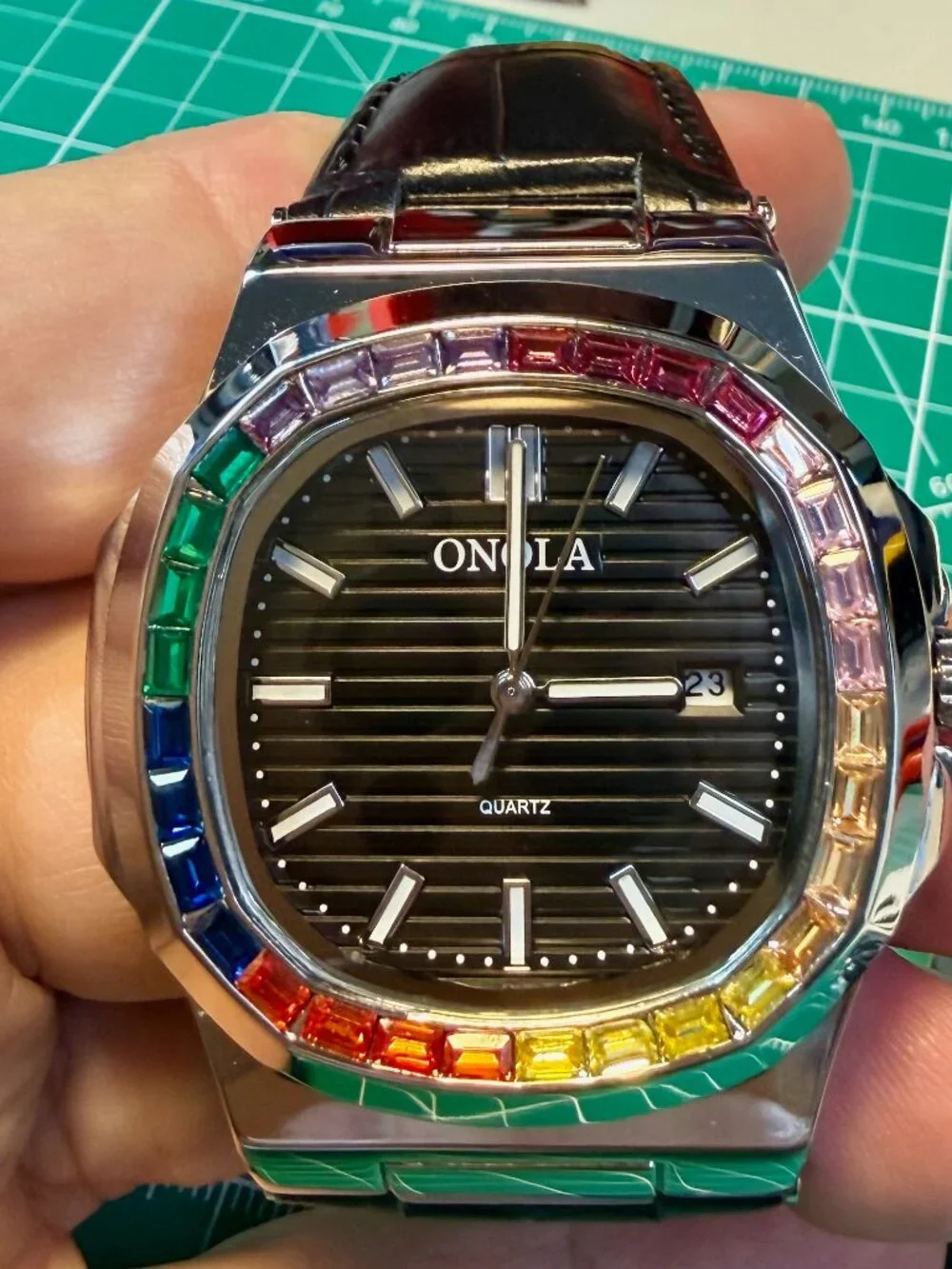 Onola quartz men's watch silver and black leather strap. Rainbow Gems Bezel.